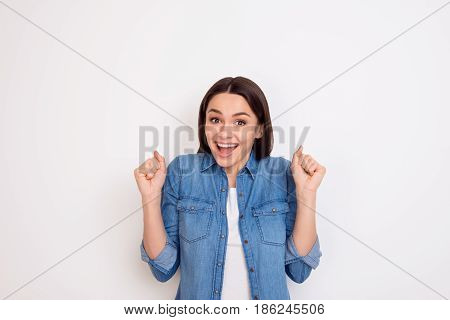 Portrait Of Excited Young Girl In Jeans Shirt Opened Mouth Expressing Happiness