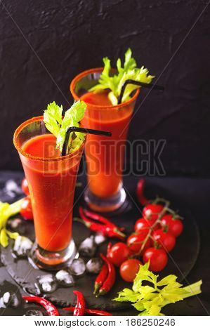 Bloody Mary Cocktail With Chili Pepper, Ice And Selery.
