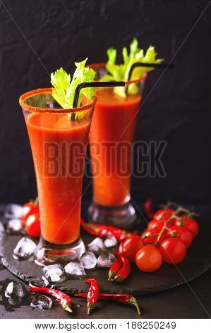 Bloody Mary Cocktail With Chili Pepper, Ice And Selery.