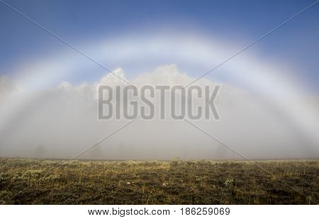Fogbow Forms Over The Tetons On A Foggy Evening