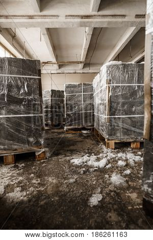 Aerated concrete blocks on pallets shot in studio being repaired