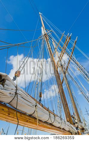 Folded sail and mast on an old sailboat