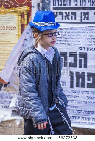 JERUSALEM - MARCH 13 : Ultra Orthodox child during Purim in Mea Shearim Jerusalem on March 13 2017 Purim is a Jewish holiday celebrates the salvation of the jews from genocide in ancient Persia