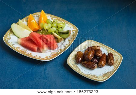 Sweet dates, fresh and healthy fruits are consumed before breaking fast during holy month of Ramadan. An Iftar meal ritual of muslims around the world.
