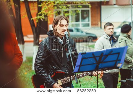 Russia Siberia Novokuznetsk - may 9 2017: musicians sing songs on the street on victory day