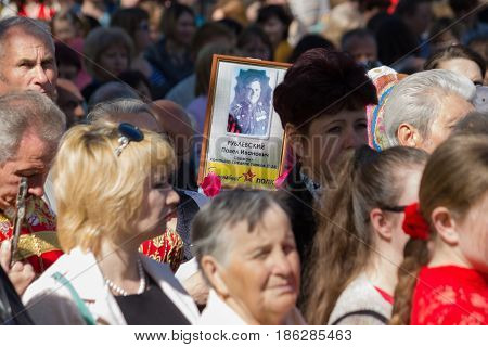 MARGANETS UKRAINE - MAY 9 2017: Townspeople of Marganets carry portraits of their heroic relatives that participated in the Second World War on meeting dedicated to celebrating Victory over Nazism