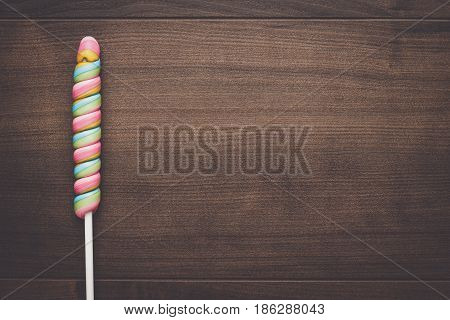 colorful sugar lollipop on the wooden table