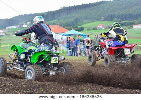 Unidentified Racers Rides A Quad Motorbike.