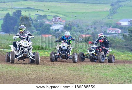 Unidentified Racers Rides A Quad Motorbike.