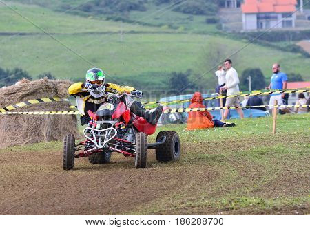 Unidentified Racer Rides A Quad Motorbike.