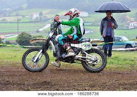Unidentified Racer Rides A Classic Motorcycle.
