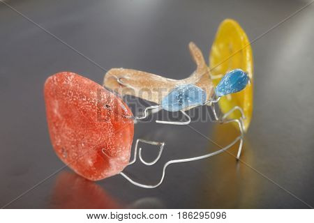 Old dental braces or retainers for teeth on blue metall background closeup