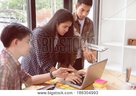 Young University Students Studying With Computer And Tablet In Cafe. Group Of People In Campus Libra