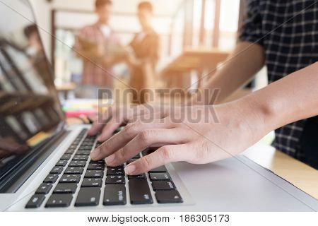 Young University Students Studying With Computer In Cafe. Group Of People In Campus Library. College