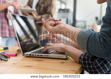 Young University Students Studying With Computer In Cafe. Group Of People In Campus Library. College
