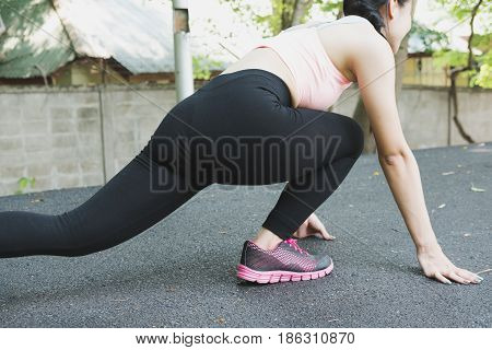 Sportswoman Athletic On Starting Point And Ready For Competition. Healthy Young Asian Athlete Woman