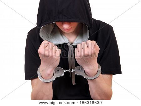 Young Man in Handcuffs on the White Background