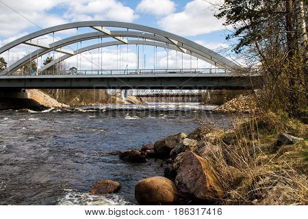 Russia. The Leningrad Region. Losevo. Bridge over the river Vuoksa with river rapids