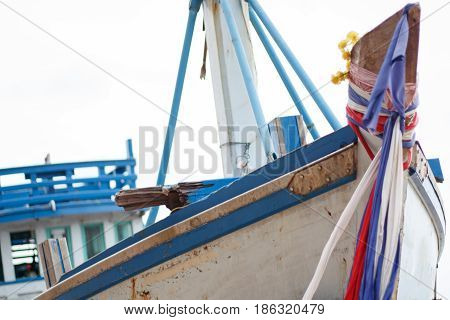 Small fishing boats near the island. shipwreck