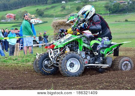 Unidentified Racers Rides A Quad Motorbike.