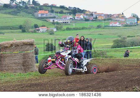 Unidentified Racer Rides A Quad Motorbike.