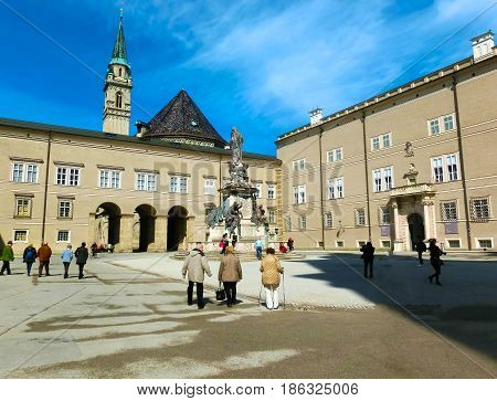 Salzburg, Austria - May 01, 2017: Classic view of famous Maria Immaculata sculpture at Domplatz square on a sunny day with blue sky in summer, Salzburg, Austria on May 01, 2017