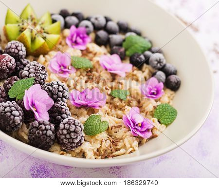 Tasty And Healthy Oatmeal Porridge With Fruit, Berry And Flax Seeds. Healthy Breakfast. Fitness Food