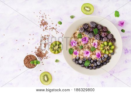 Tasty And Healthy Oatmeal Porridge With Fruit, Berry And Flax Seeds. Healthy Breakfast. Fitness Food