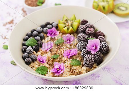 Tasty And Healthy Oatmeal Porridge With Fruit, Berry And Flax Seeds. Healthy Breakfast. Fitness Food
