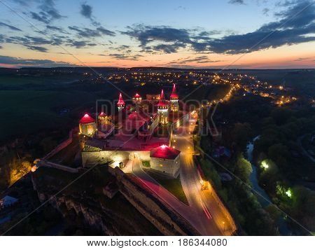 Night Aerial view of Kamianets-Podilskyi Castle in Ukraine.