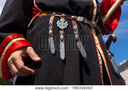 BERLIN - JUNE 11 2016: Russian Cossack shows decorative details of the uniforms. German-Russian festival devoted to the Independence Day of Russia. District Karlshorst East Berlin.