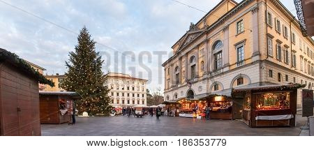 Christmas Market With Huts Lit And Decorated