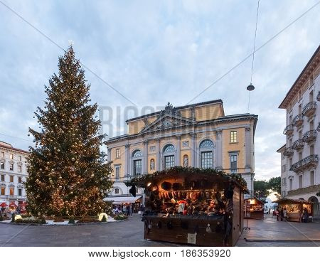 Christmas Market With Huts Lit And Decorated