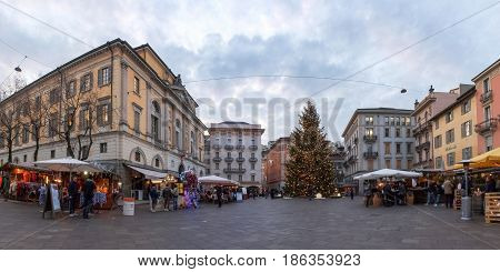 Christmas Market With Huts Lit And Decorated