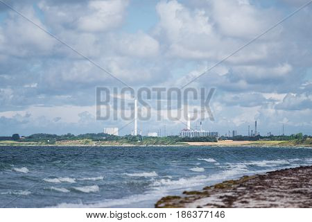 Asnaes power station in Kalundborg Denmark, seen over sea