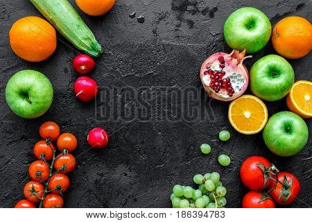 Organic fruits and vegetables for healthy dinner on darkbackground top view mock up