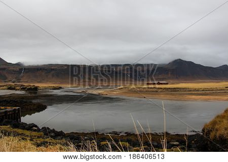 Landscape view of the big mountain and the grass field on the way to Reykholt autumn Iceland