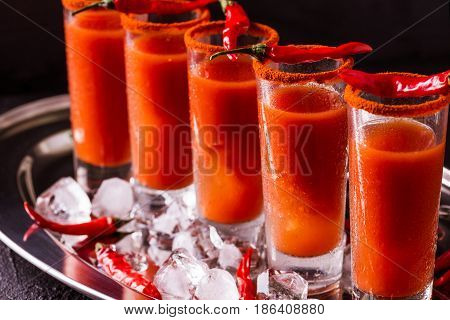 Bloody Mary Cocktail With Chili Pepper, Ice And Celery.