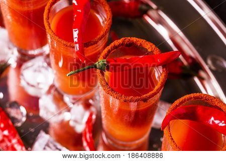 Bloody Mary Cocktail With Chili Pepper, Ice And Celery.