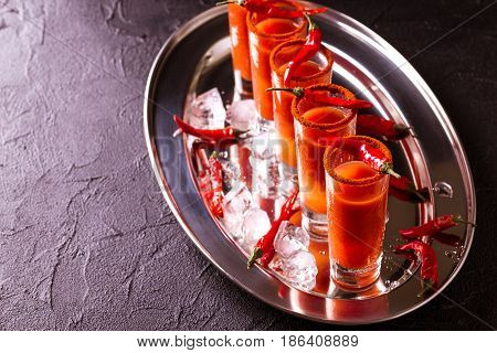 Bloody Mary Cocktail With Chili Pepper, Ice And Celery.