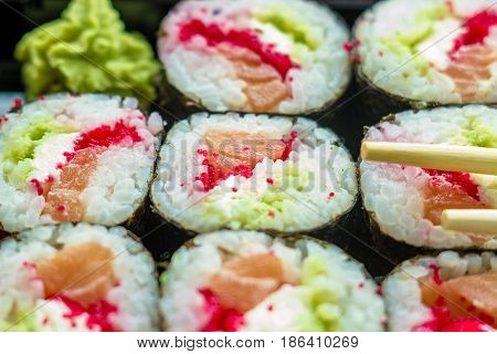 The Plate Of Sushi With Soy Sauce, Wasabi And Chopsticks
