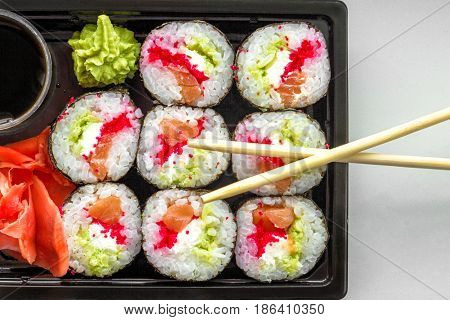 The Plate Of Sushi With Soy Sauce, Wasabi And Chopsticks