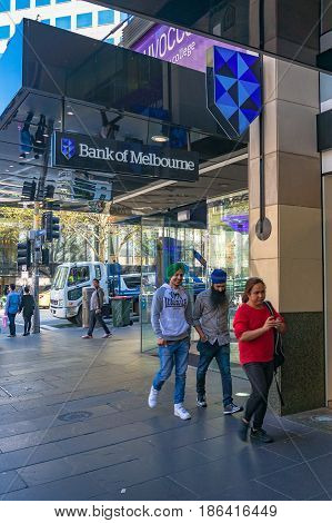 Smiling Sikh Men Going Past Bank Of Melbourne