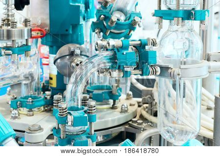 Chemical industrial equipment, glass tubes and containers. Abstract industrial background.