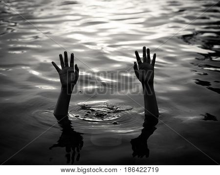 Drowning victims Hand of drowning man needing help. Failure and rescue concept.