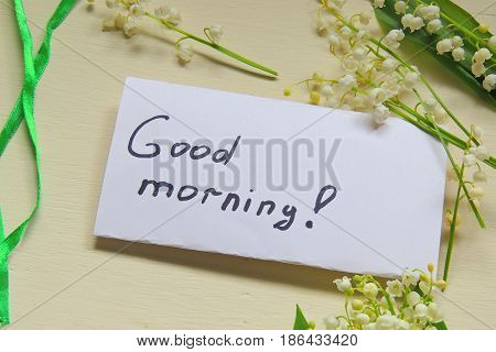 The inscription Good morning and lilies of the valley