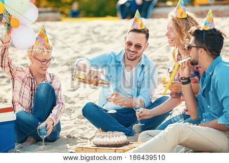 Friends Celebrating Birthday On Th Beach
