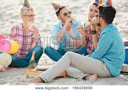 Friends Celebrating Birthday On Th Beach
