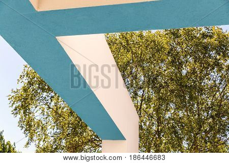 Architectural Corner detail of modern white and blue rendered building with blue sky