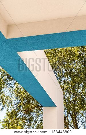 Architectural Corner detail of modern white and blue rendered building with blue sky